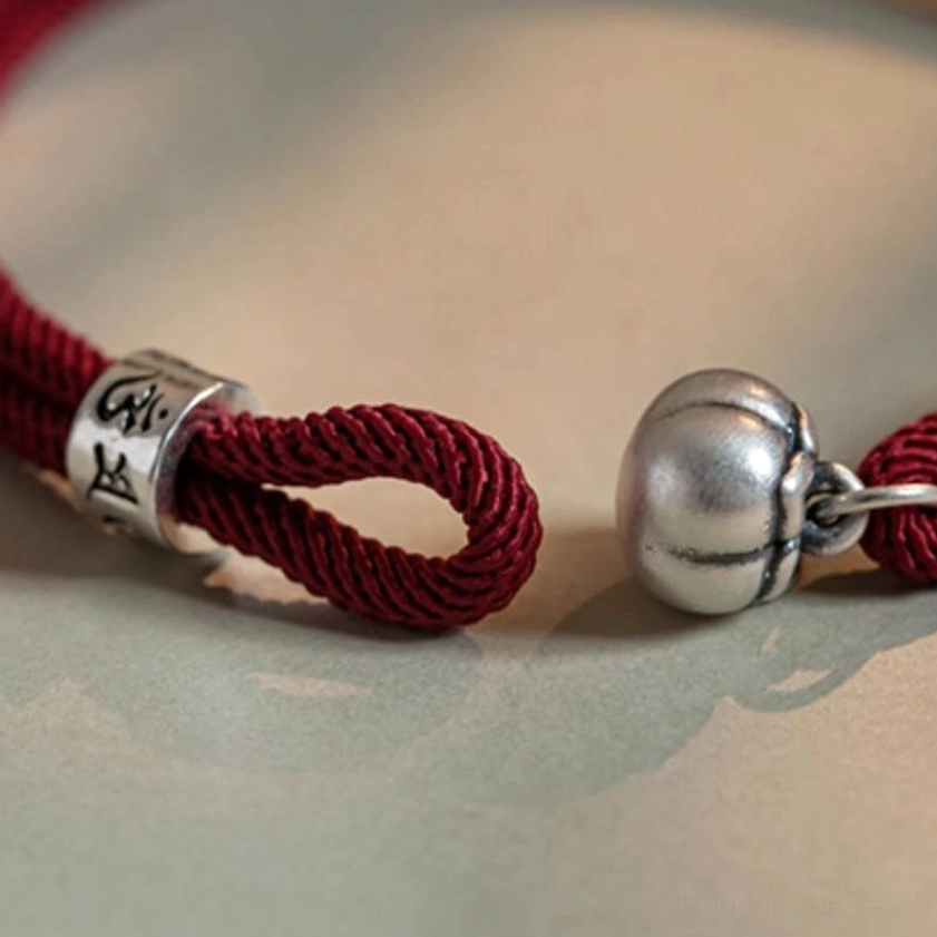 Handmade sterling silver Om Mani Padme Hum Buddhist bracelet with protective red string full product view