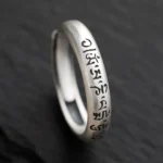 Om Mani Padme Hum sterling silver Buddhist mantra ring side view close-up showing engraved six true words on adjustable band