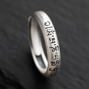Om Mani Padme Hum sterling silver Buddhist mantra ring side view close-up showing engraved six true words on adjustable band