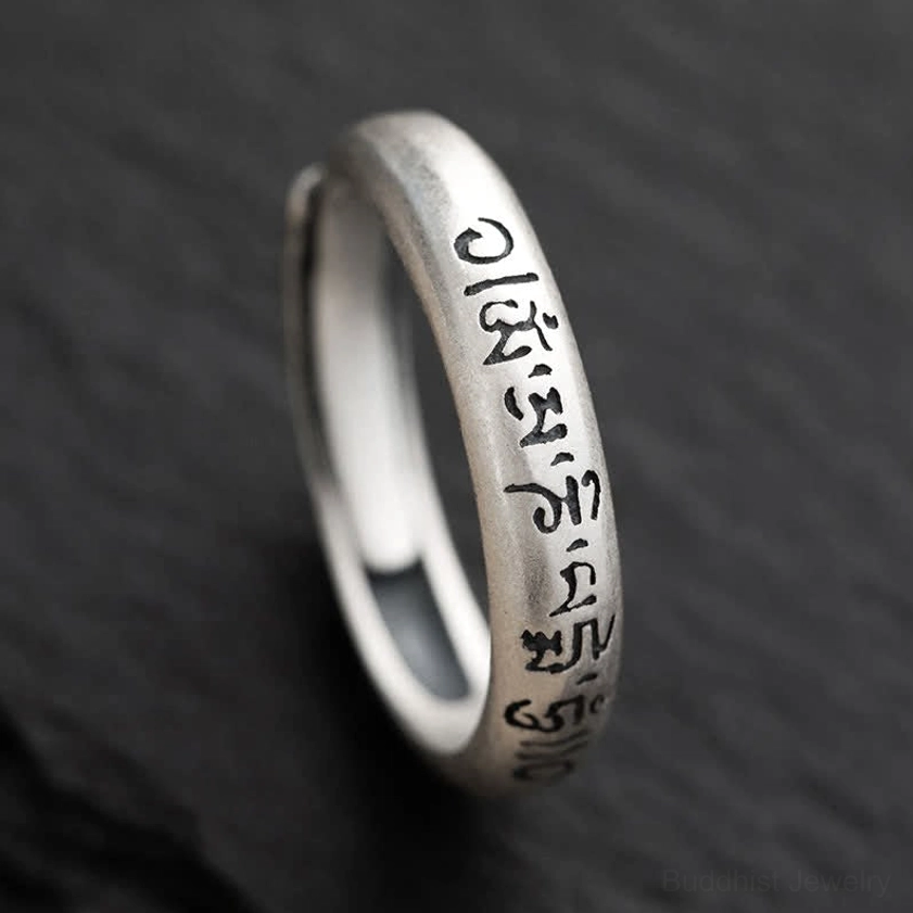 Om Mani Padme Hum sterling silver Buddhist mantra ring side view close-up showing engraved six true words on adjustable band