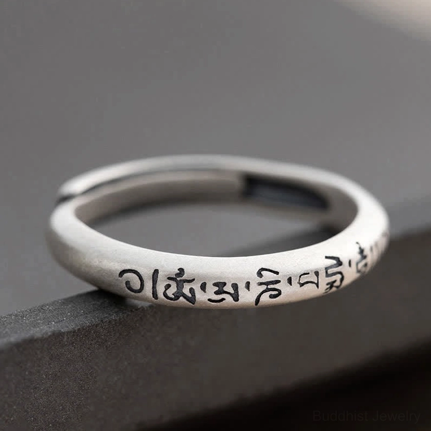 Single Om Mani Padme Hum sterling silver Buddhist mantra ring side close-up showing engraved text matte finish