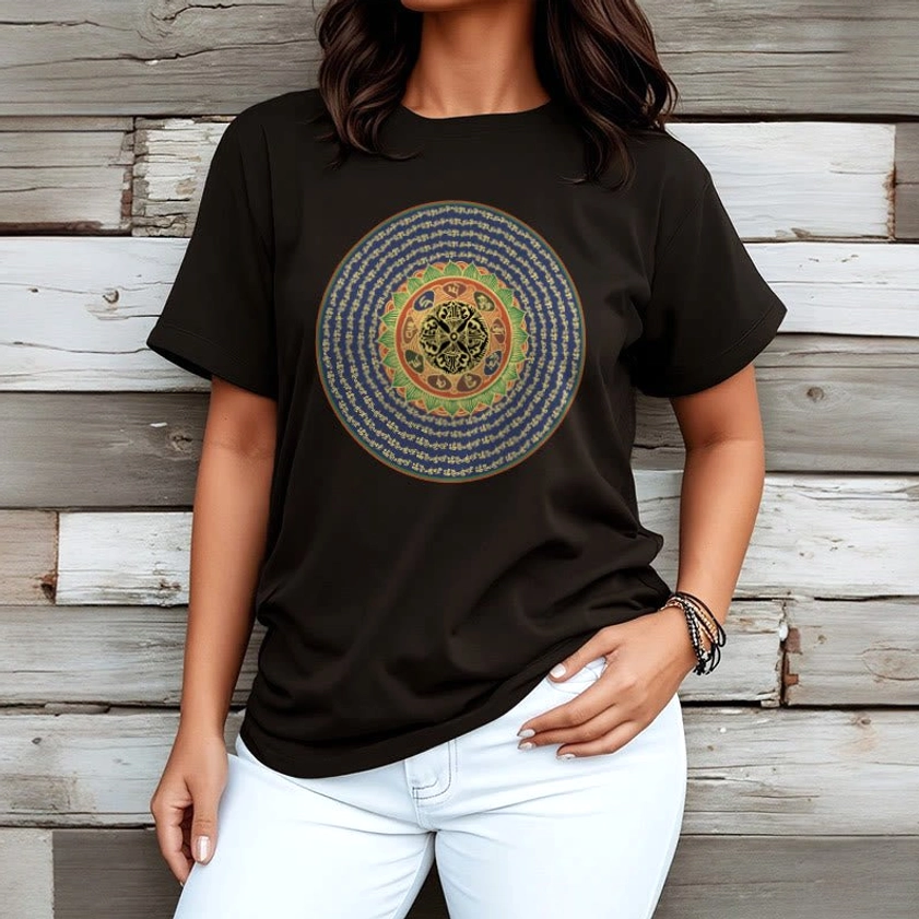 Person wearing om mani padme hum buddhist tshirt white pants wooden wall background relaxed fit
