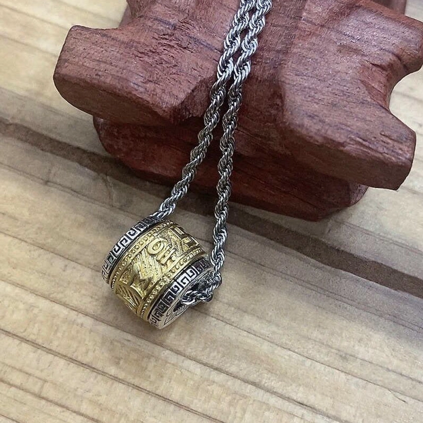Two-tone gold and silver Buddhist pendant necklace with twisted chain, dual finish mantra design