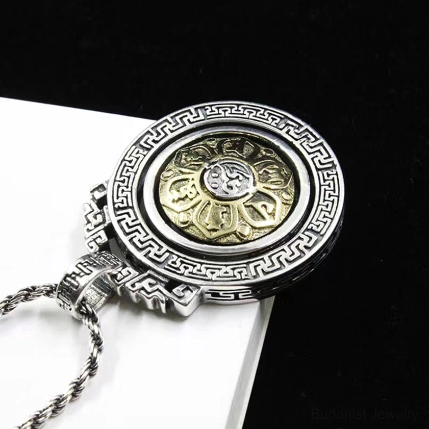 Buddhist mantra pendant back view showing engraved Sanskrit script and dual-tone vintage silver finish with twisted chain