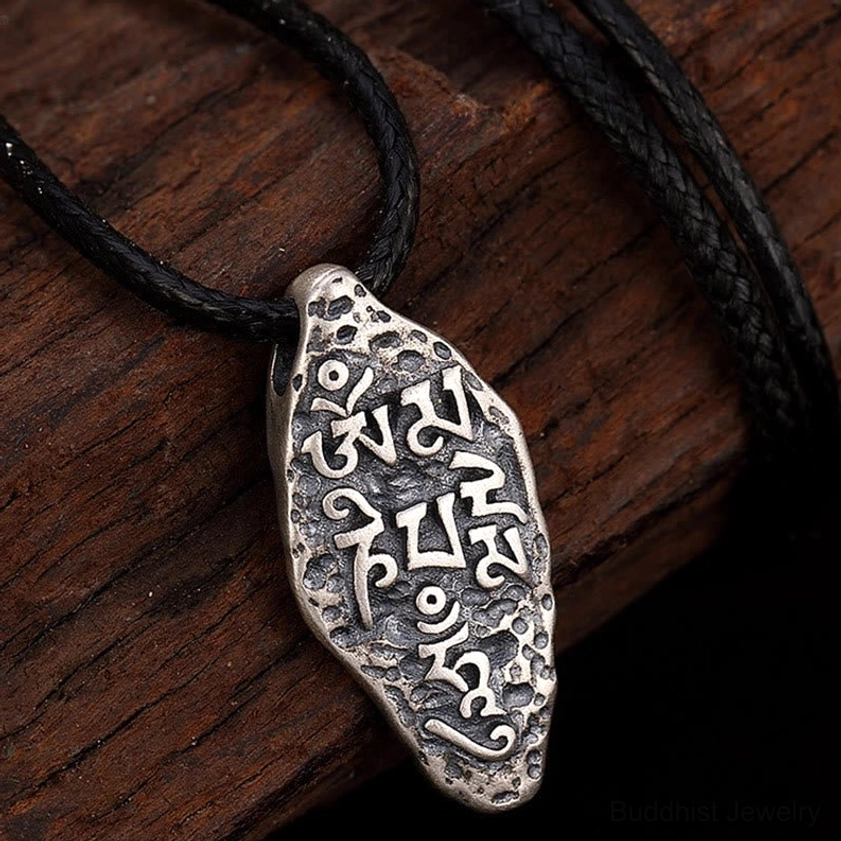 Om Mani Padme Hum Vajra necklace detail shot showing sterling silver pendant craftsmanship and sacred mantra engravings