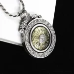 Om Mani Padme Hum rotatable double vajra Buddhist pendant necklace front view with silver frame and gold lotus design