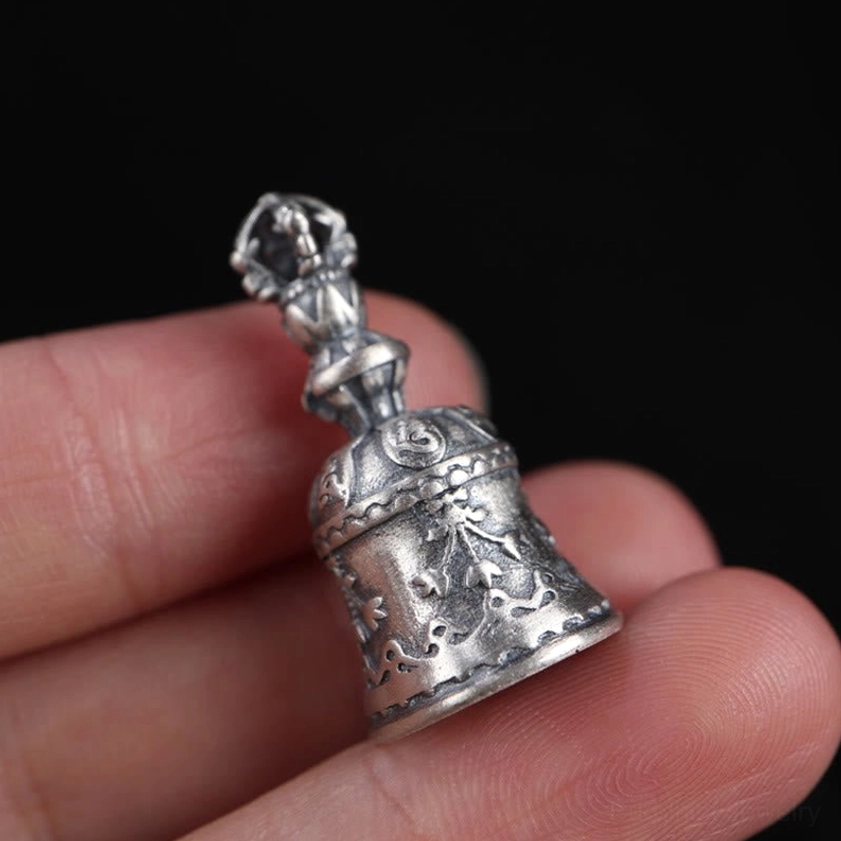 Sterling silver Om Mani Padme Hum vajra bell pendant with protective and spiritual blessing properties