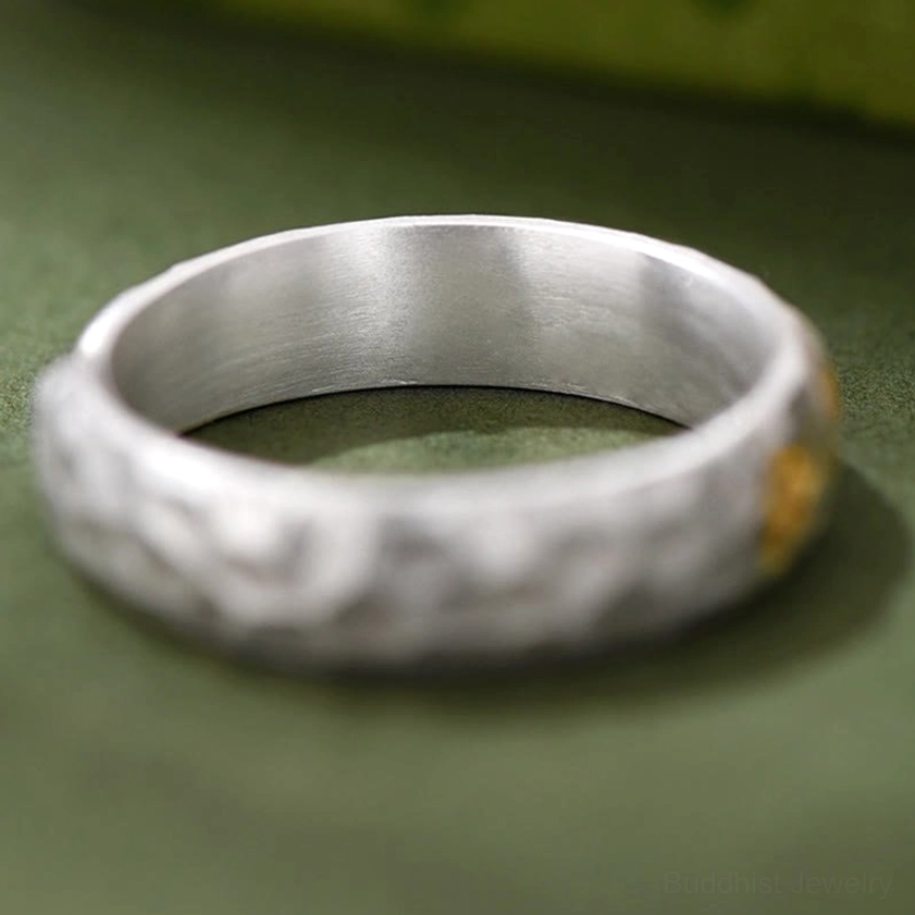Om Mani Padme Hum copper silver ring three-quarter view highlighting two-tone metal blend and craftsmanship