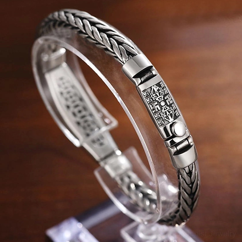 Om Mani Padme Hum copper bracelet with Vajra symbol detail close-up showing engraved mantra characters and craftsmanship