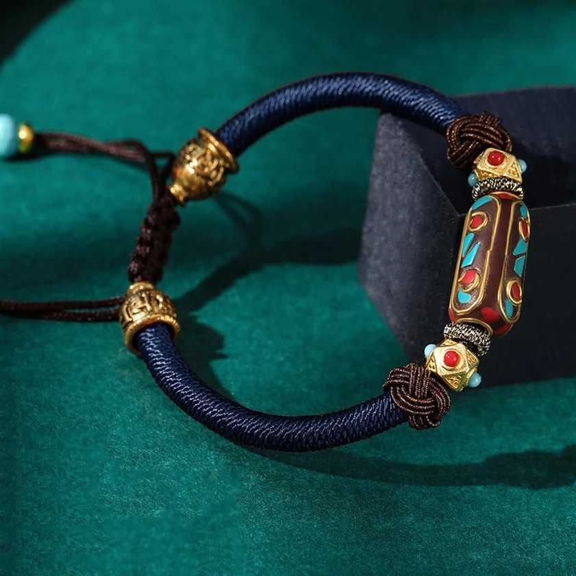 Blue color variant of handmade Om Mani Padme Hum Buddhist bracelet with premium braided cord and enamel mantra charm for wisdom and protection