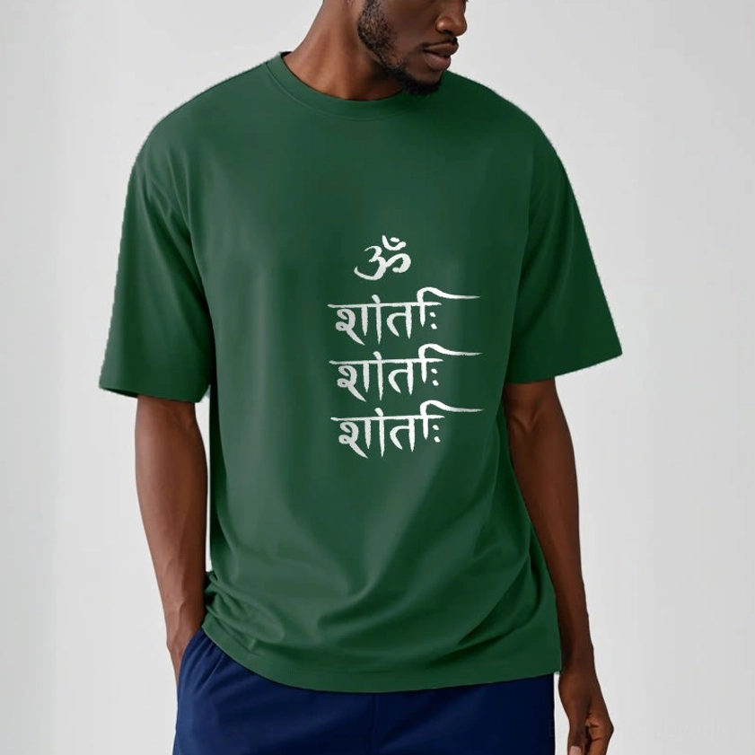 Male model wearing dark green OM mantra Buddhist spiritual t-shirt with white chest print, regular fit, indoor setting