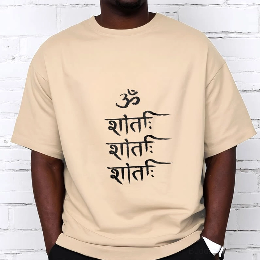 Male model styling light grey OM mantra Buddhist casual tee with white chest print, true-to-size regular fit