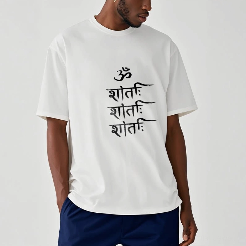 Male model wearing white OM mantra Buddhist unisex t-shirt with black chest print, regular fit, indoor background