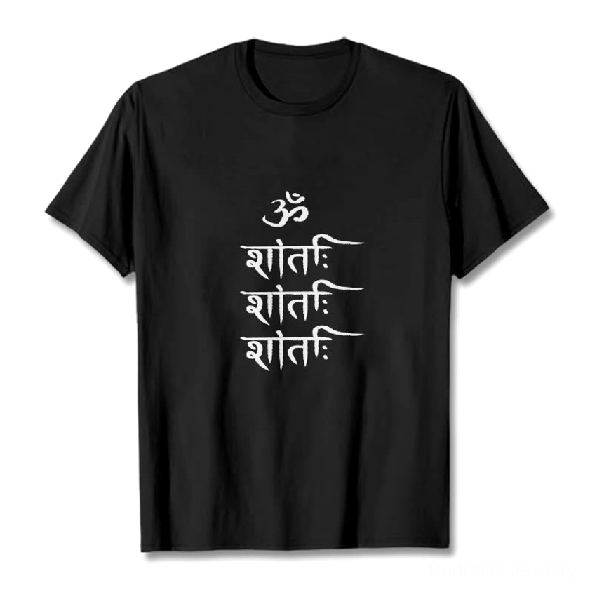 Flat lay front view of black OM mantra Buddhist t-shirt with white Sanskrit symbol print on plain backdrop