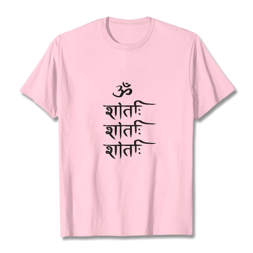 Light cyan OM mantra Buddhist unisex t-shirt flat lay display with white Sanskrit print on studio backdrop