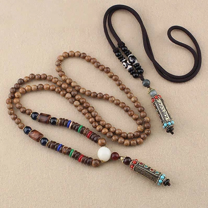 Two variations of Om Mani Padme Hum Buddhist necklaces side by side, string cord and wood bead chain styles