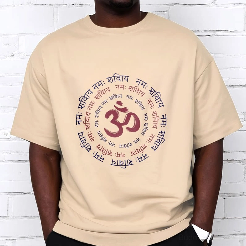Men wearing beige OM mantra Sanskrit cotton t-shirt brick wall background