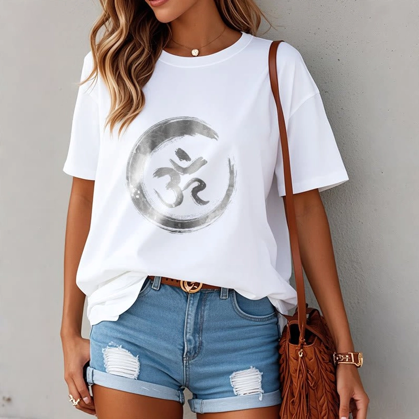 Women's OM Sanskrit spiritual tee styled with denim shorts, casual yoga lifestyle wear