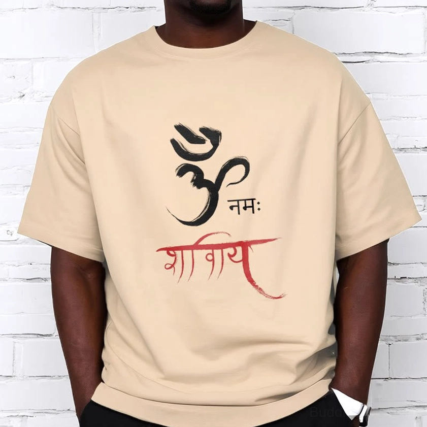 Male model wearing pale green Om Namah Shivaya spiritual tee, relaxed cotton fit front view