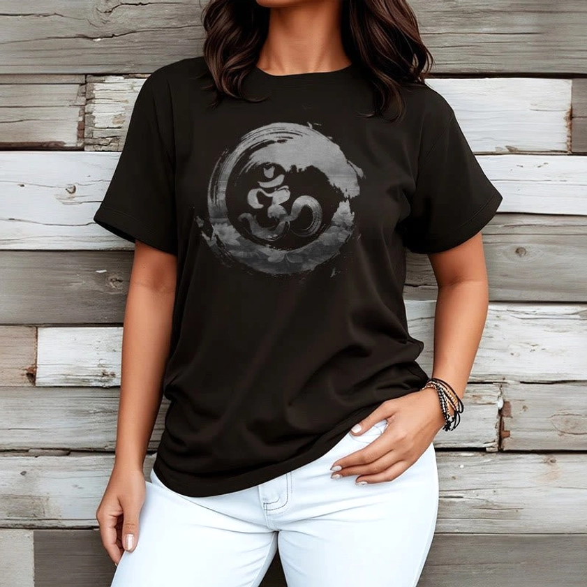Buddhist Om graphic tee worn half body view relaxed casual fit wooden backdrop