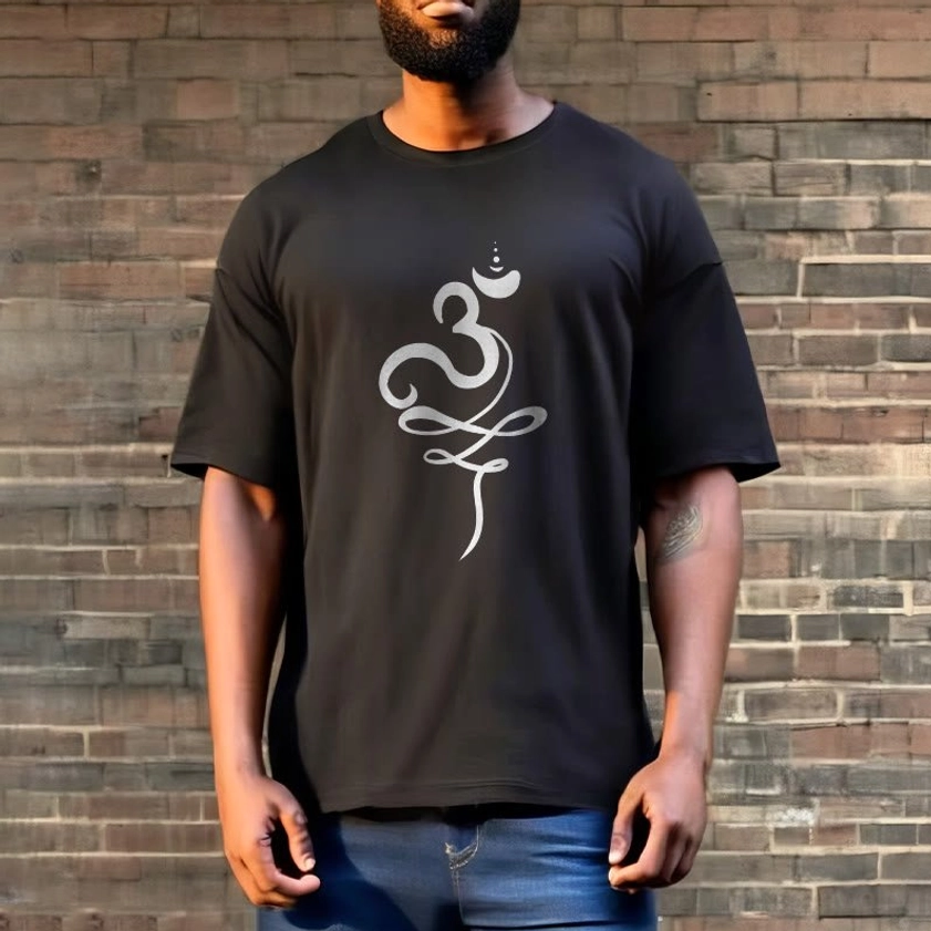 Male model full body wearing OM Sanskrit Buddhist T-Shirt street style brick wall