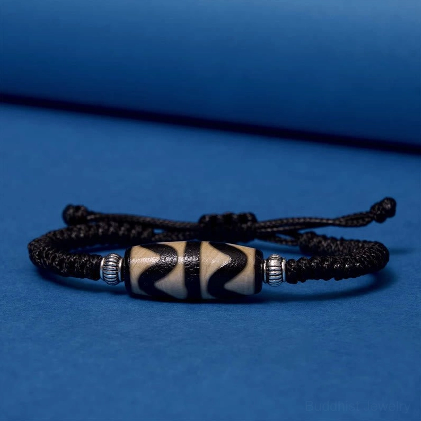 One-eye dzi bead bracelet on wrist showing comfortable adjustable fit and real-world wear