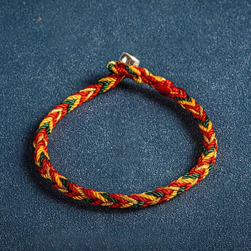 Orange, dark green and red multicolored Buddhist protection bracelet with sterling silver charm, available in multiple wrist circumference sizes