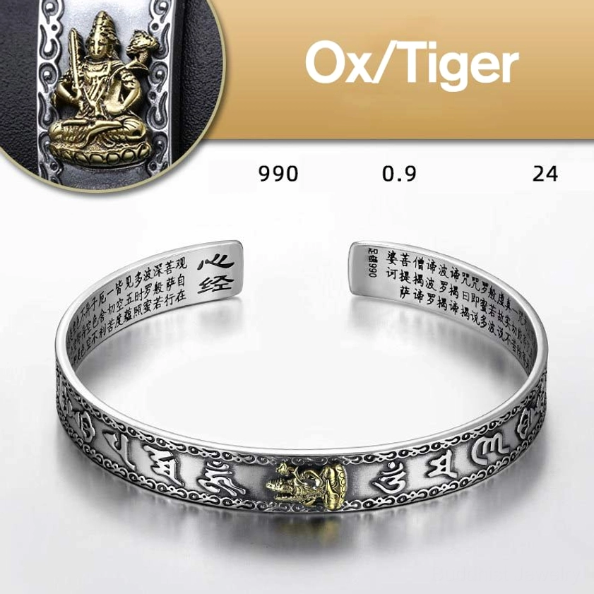 Ox and Tiger zodiac natal buddha silver cuff bracelet with guardian deity figure and Sanskrit engravings