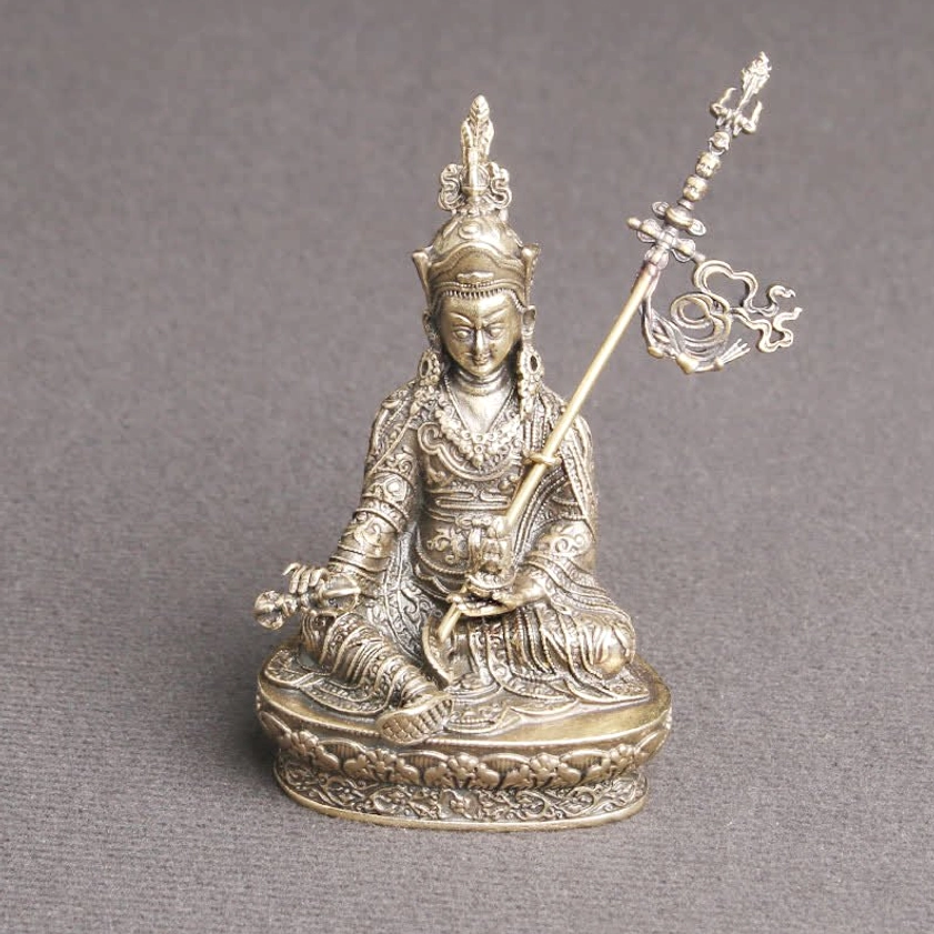 Padmasambhava Buddha meditation statue elevated view showing ornate carved robes and ceremonial headdress details