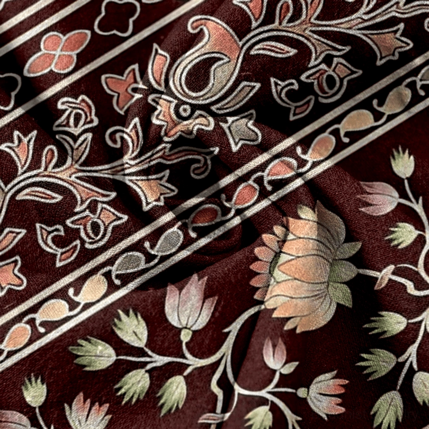Vintage paisley and lotus stripe texture on burgundy women's harem pants fabric closeup