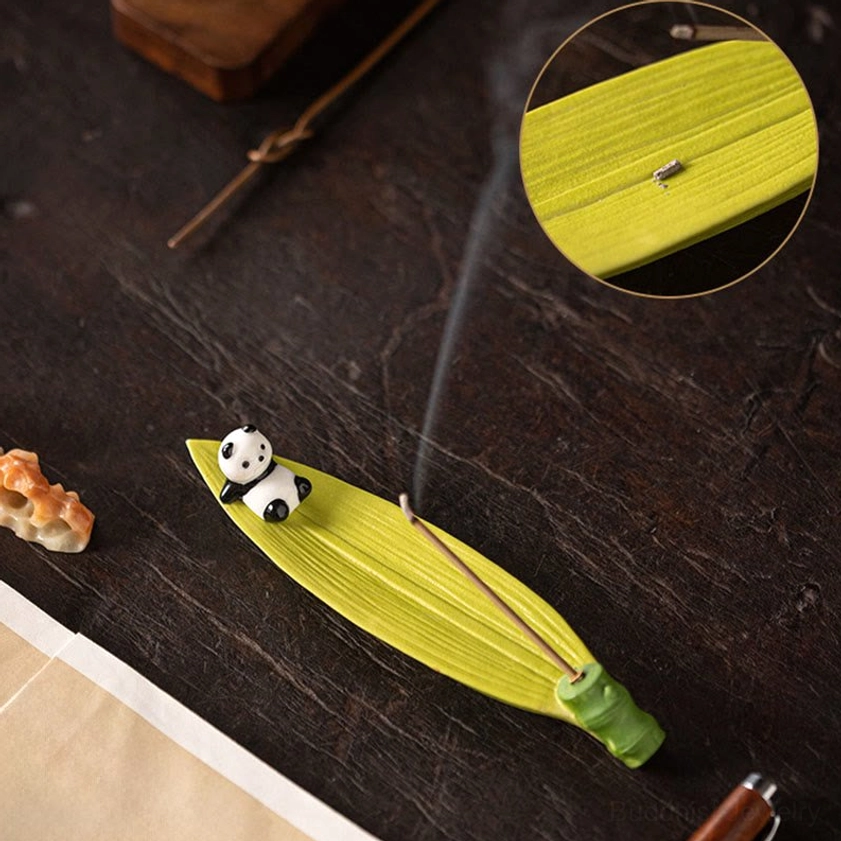 Panda bamboo leaf incense holder with detailed slot view, angled top perspective, green ceramic with smoking incense