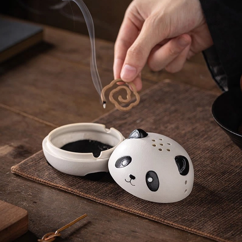 Handcrafted panda incense holder showing perforated lid design and black panda facial features on white ceramic