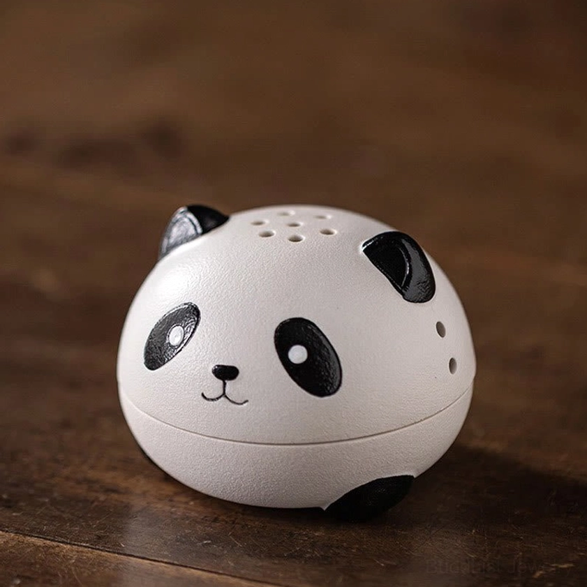 Top-down view of panda incense holder displaying perforated smoke vent lid and classic black-and-white panda ceramic design