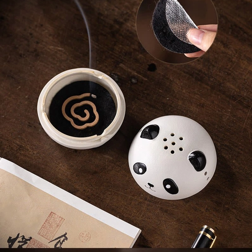 Handcrafted panda-shaped ceramic incense burner with active burning incense demonstrating smoke release and fragrance dispersion