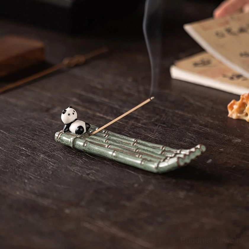 Ceramic panda incense holder positioned on meditation space with natural lighting, zen aesthetic display