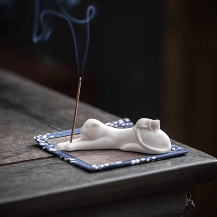 Panda incense holder from various angles showing detailed ceramic craftsmanship, gold accent, and included bamboo mat for aesthetic presentation