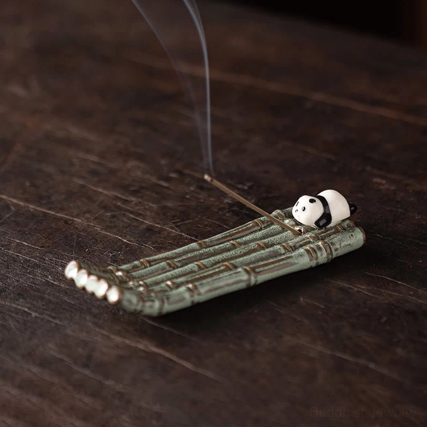 Ceramic panda lying on stomach incense burner, compact size design on wooden surface with incense