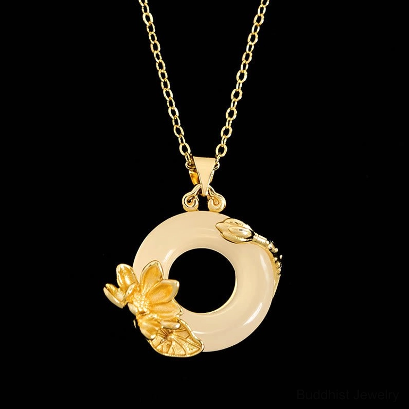 Lotus peace buckle Buddhist necklace with polished gold chain under studio lighting, elegant pendant design with high contrast
