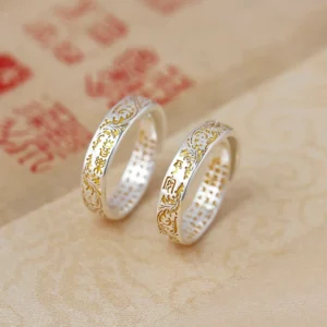 Pair of peace and joy adjustable lotus rings with Tang dynasty flower patterns and heart sutra carvings in two-tone copper finish
