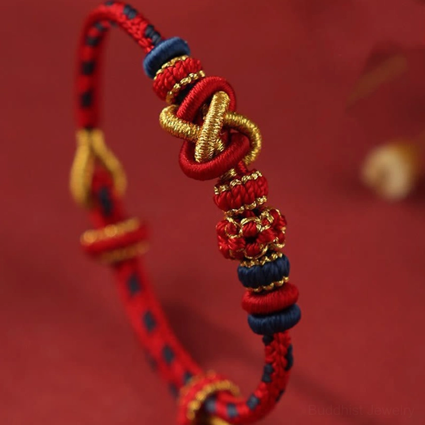 Close-up side view of multicolor peace knot Buddhist string bracelet showing intricate woven knot details and braided rope structure