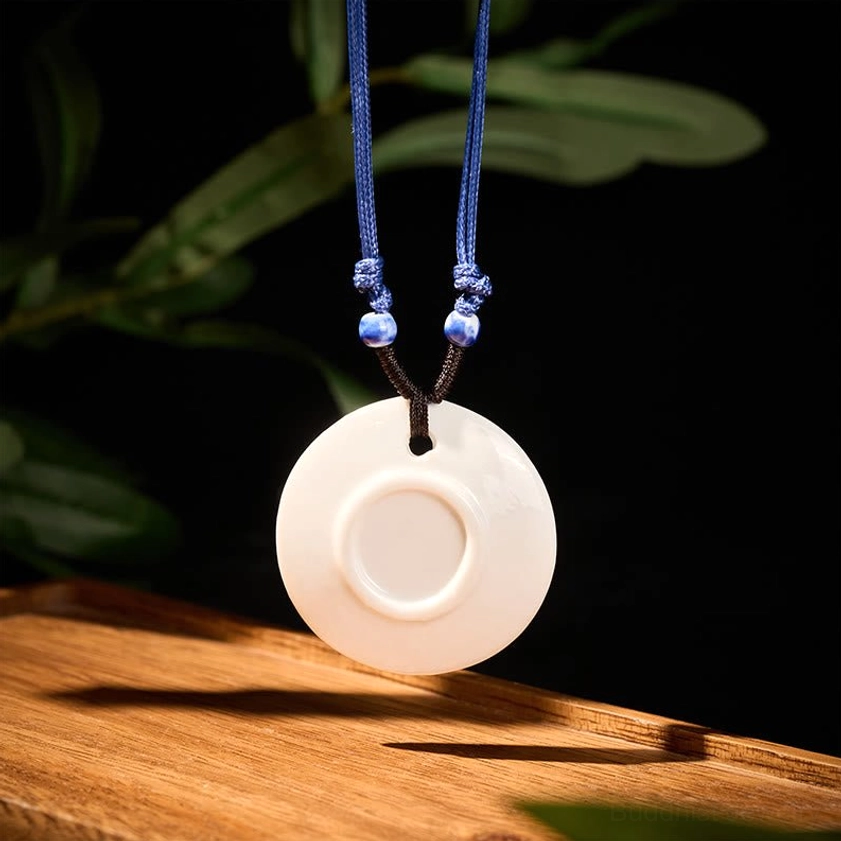 Peach blossoms ceramic pendant necklace close-up detail view of hand-painted floral pattern