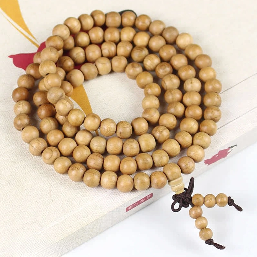 8mm normal style peach wood prayer mala beads flat lay top view