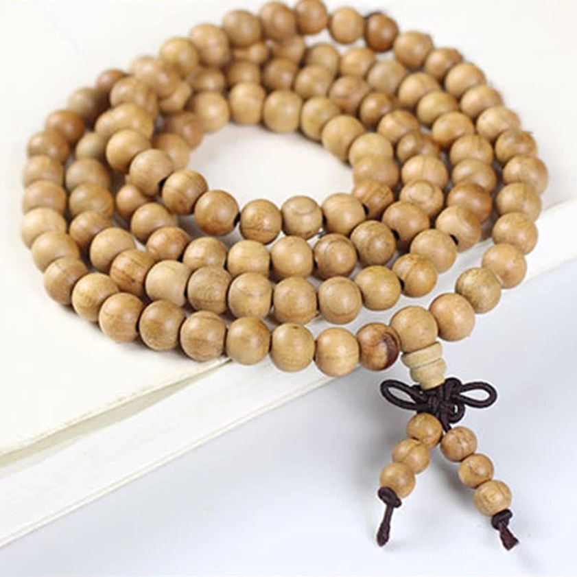 Hand-polished peach wood 108 bead mala with dark grain and traditional knot