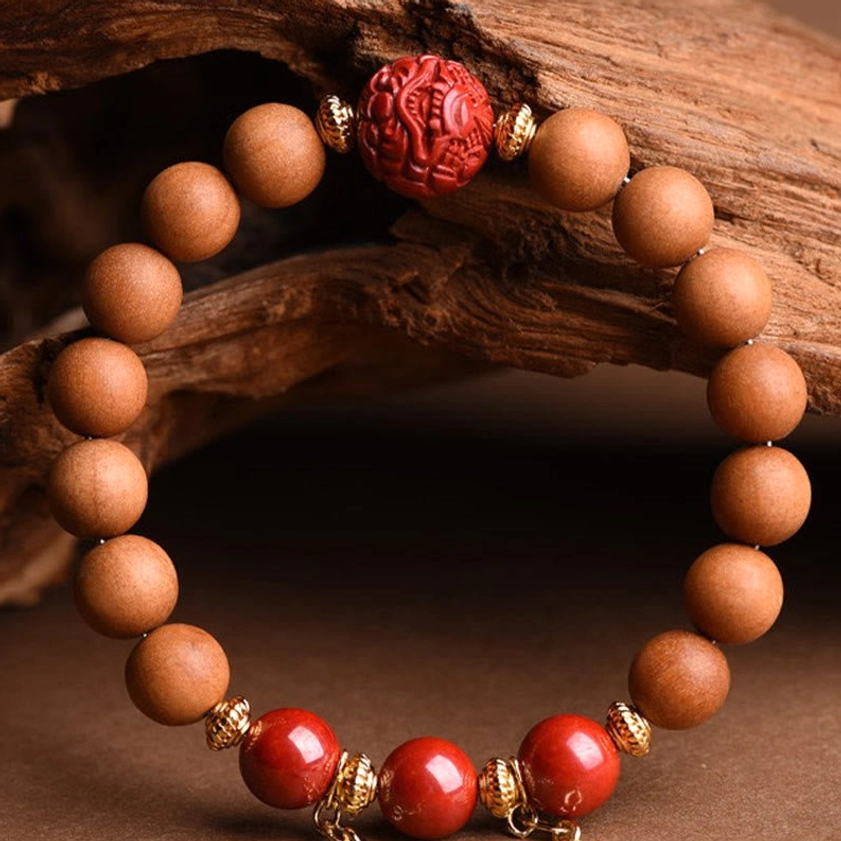 Natural peach wood pixiu bracelet without tassels, featuring red cinnabar accents for subtle daily spiritual wear