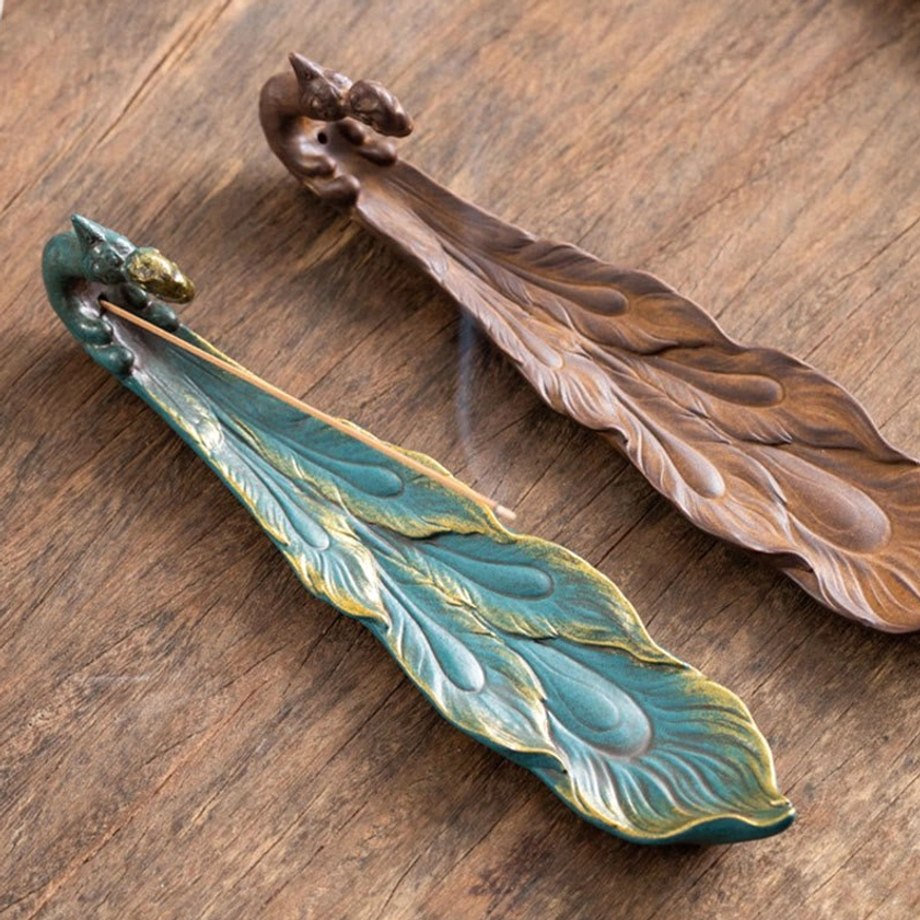 Peacock incense burner Buddhist spiritual symbolism tabletop decoration zen ambiance