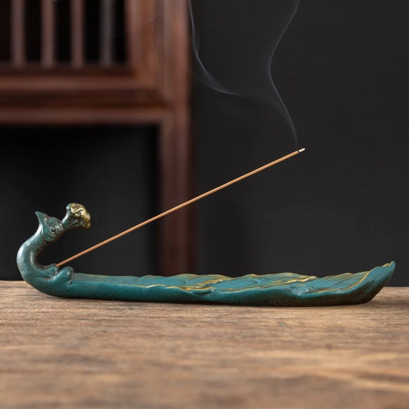 Peacock shaped incense holder front view burning incense smooth feather texture ceramic