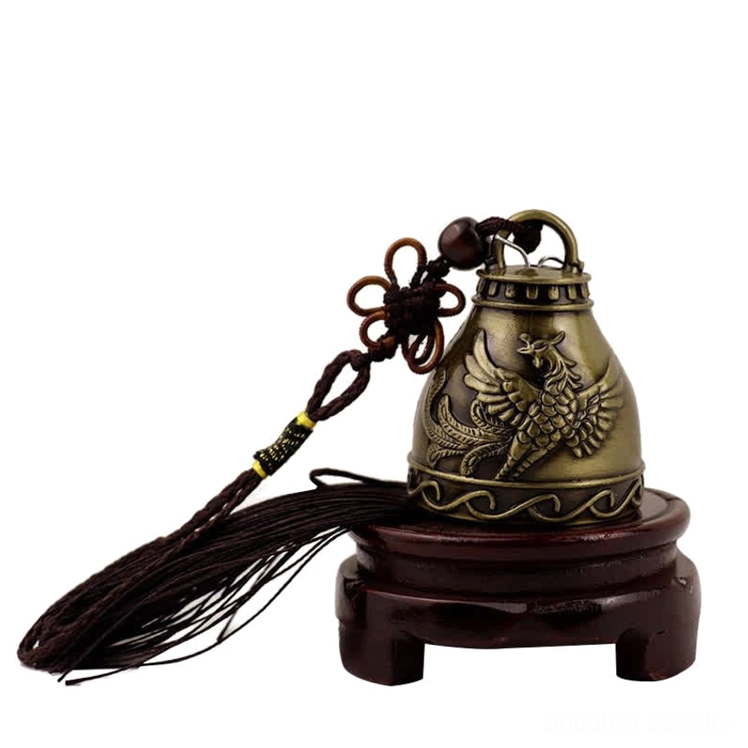 Phoenix embossed wind chime bell with carved motif and dark tassel on wooden display stand