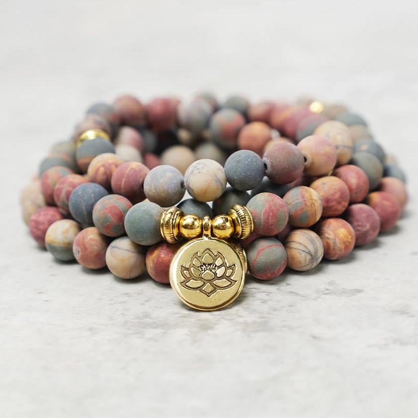 Stacked Picasso Jasper mala prayer bead bracelet displaying natural stone texture and gold spacer beads