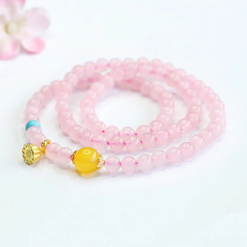 Pink crystal lotus charm bracelet elastic design showing comfortable fit