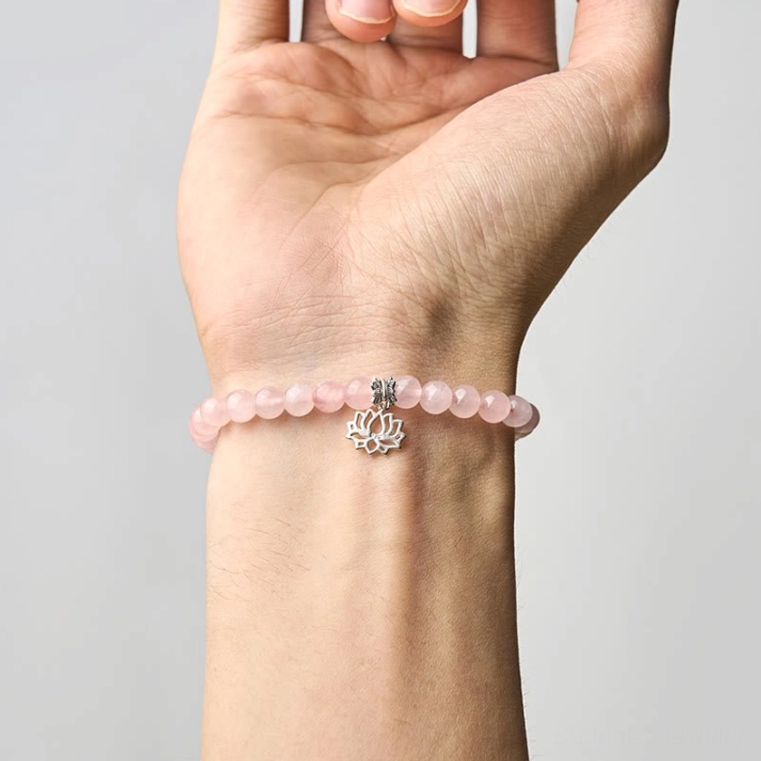 Pink crystal lotus bracelet with premium elastic cord featuring sterling silver lotus charm